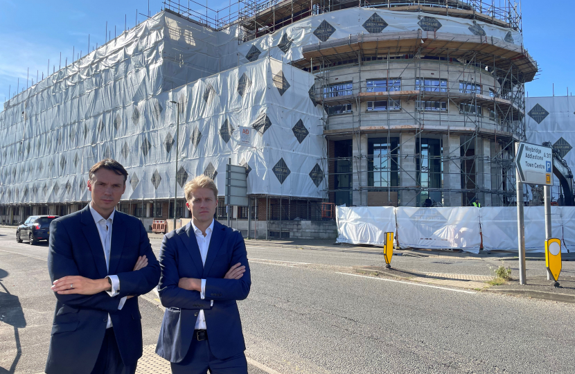 Cllr Tom Gracey and Dr Ben Spencer MP outside the proposed asylum seeker accommodation in Chertsey