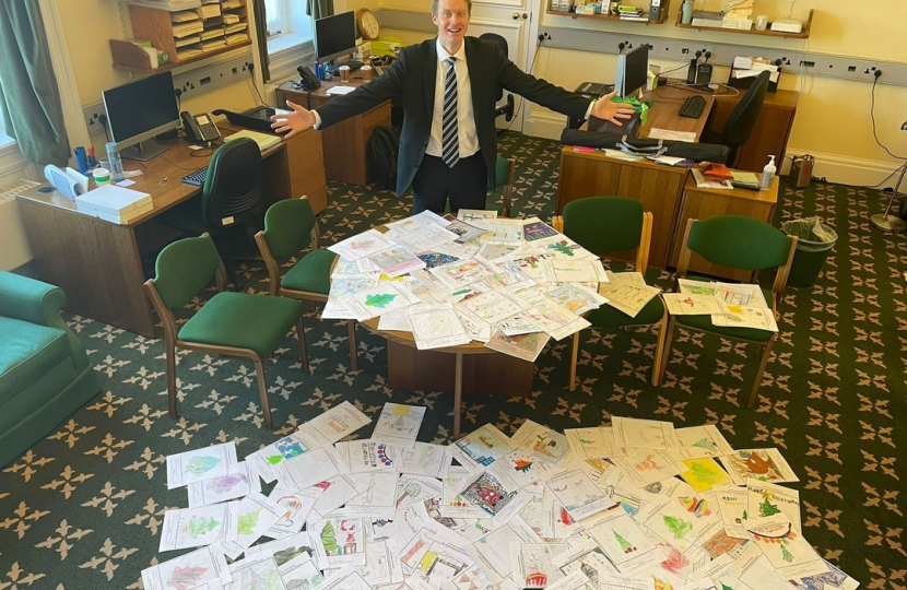 Dr Ben Spencer MP with previous Christmas card competition entries