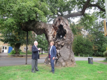 Dr Ben Spencer MP and Mr Ian Mawson, Chairman, Addlestone Historical Society, by the Crouch Oak, Addlestone