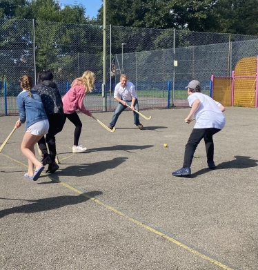 A quick game of hockey at Gogmore Park Youth Club