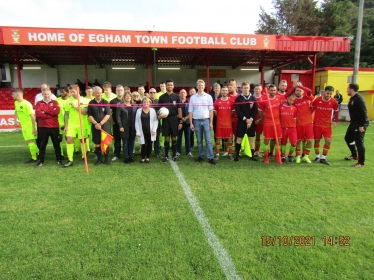 The guests and teams at Egham Town Football Club before the ribbon is cut. Photo courtesy of Mark Ferguson