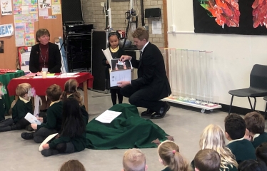 Presenting the winning certificate at the Grange Infant School